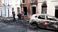 Damaged homes in Belfast after night of anti-immigration protests