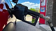 File - A pump fills up the tank of a vehicle at an Exxon gasoline station in Litttleton, Colo., Tuesday, 12 May 2026. 