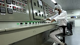 A technician works at the Uranium Conversion Facility just outside the city of Isfahan, 3 February, 2007