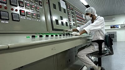 A technician works at the Uranium Conversion Facility just outside the city of Isfahan, 3 February, 2007