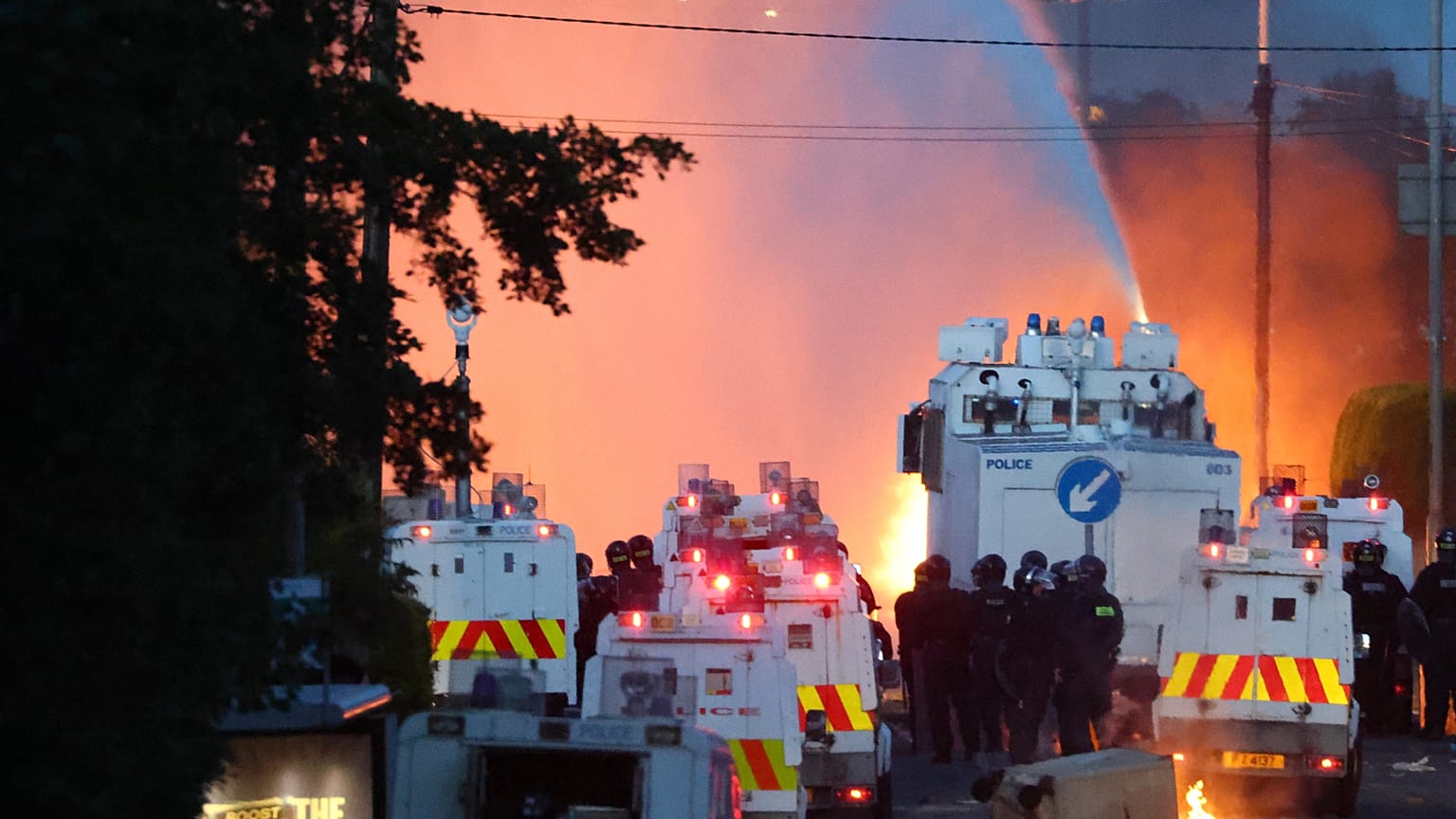 Police attempt to disperse protesters with water canon in Newtownabbey, near Belfast, Northern Ireland, Wednesday, June 10, 2026, demonstrations follow a stabbing in Belfast.
