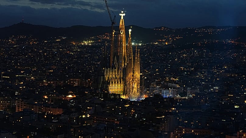Light radiates from Antoni Gaudí's Basilica of the Sagrada Familia after Pope Leo XIV blesses the Tower of Jesus Christ in Barcelona, Spain, 10 June.