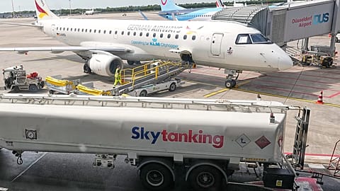 Jet fuel is transported by tank trucks to aircrafts at the airport in Duesseldorf, Germany, when airlines fear a kerosene shortage due to the war in Iran, April 27.