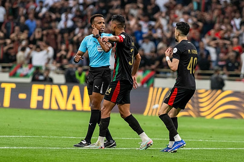 Referee Omar Artan, lef, of Somalia, during the CAF Champions League final soccer match between AS FAR Rabat and Mamelodi Sundowns, Rabat, Morocco, May 24, 2026.