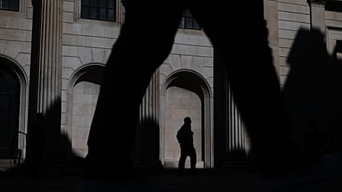 Pedestrians walk past the Bank of England in London, 30 April 2026