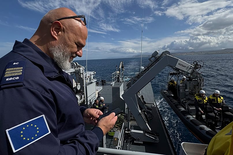 FILE - Frontex Commander observes as they prepare to lower a speedboat into the sea during a patrol in the Aegean Sea near Heraklion, Crete, Greece, Feb. 16, 2026