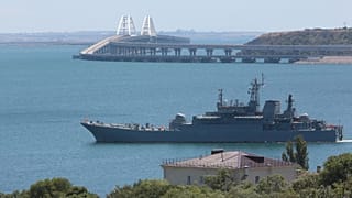 FILE - A Russian military ship transports cars and people from the Russian mainland to the Crimean Peninsula over the Kerch Strait on Monday, July 17, 2023