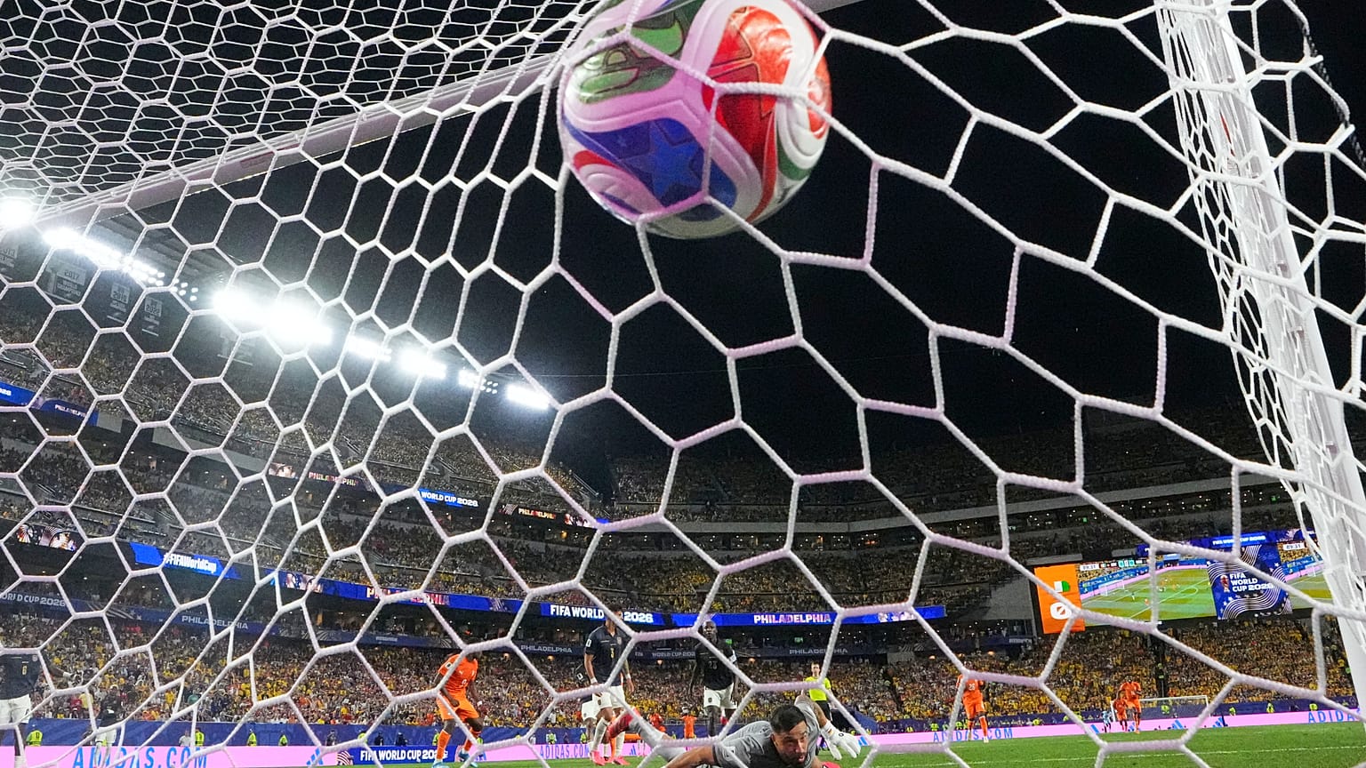 Ecuador goalkeeper Hernan Galindez looks around as Ivory Coast's Amad Diallo scores the opening goal during the World Cup Group E soccer match between Ivory Coast, 14 June.