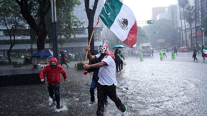 Fans celebrate after Mexico defeated South Africa in the opening match of the soccer World Cup in Mexico City, Thursday, June 11, 2026