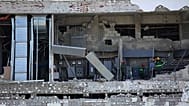 Workers inspect a damaged mall in General Santos, 11 June, 2026 