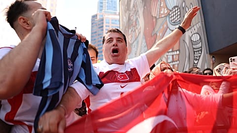Turkish fans cheer as the team arrives at their hotel in Vancouver, British Columbia, Thursday, June 11, 2026.