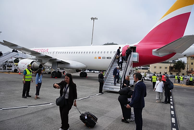 Journalists leave the papal flight after take-off was delayed at Los Rodeos International Airport, 12 June, 2026