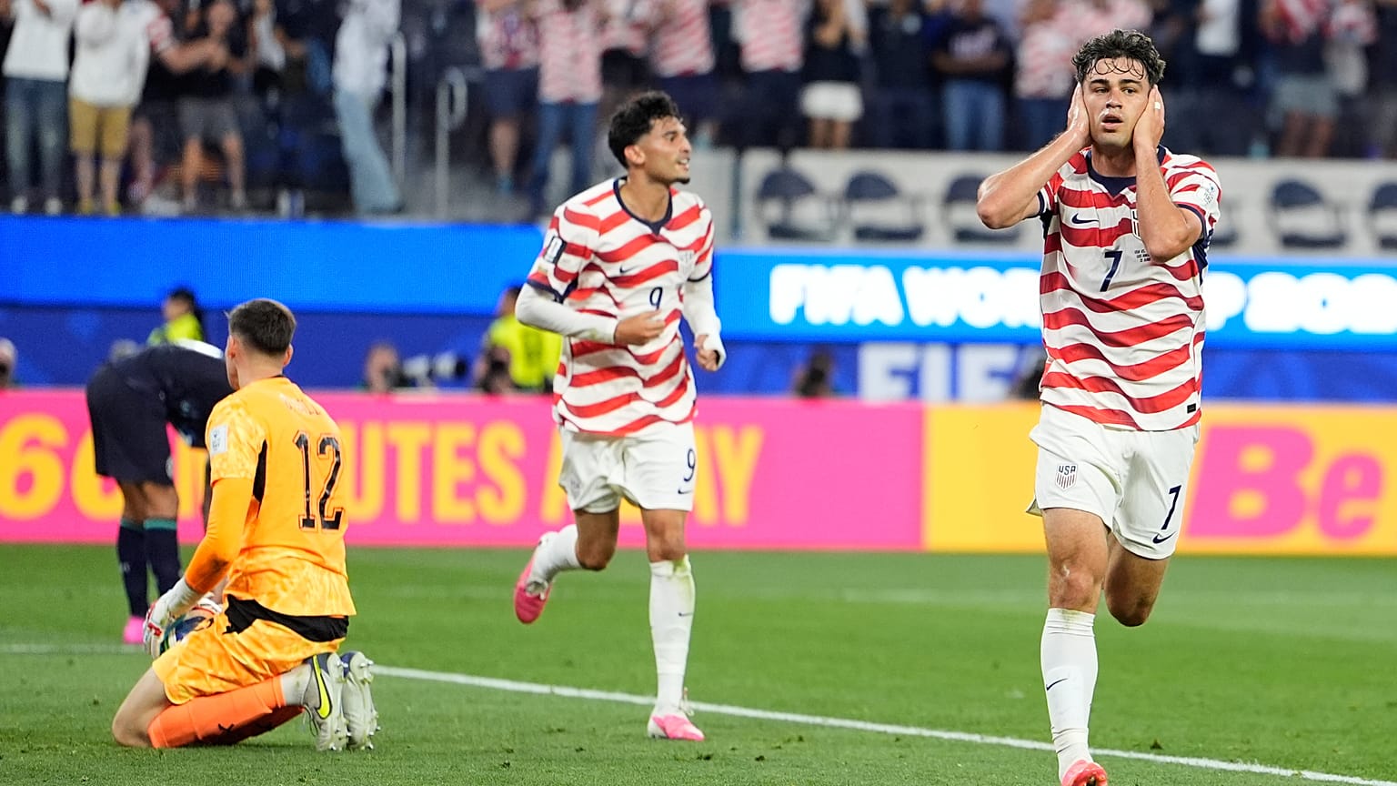 United States' Giovanni Reyna, right, reacts after scoring his team's fourth goal during the World Cup Group D soccer match between the United States and Paraguay.