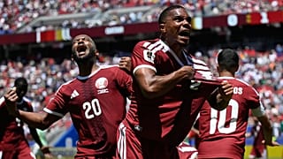 Qatar's Pedro Miguel celebrates teammate Boualem Khoukhi's goal during the World Cup match between Qatar and Switzerland in Santa Clara, Calif., near San Francisco.
