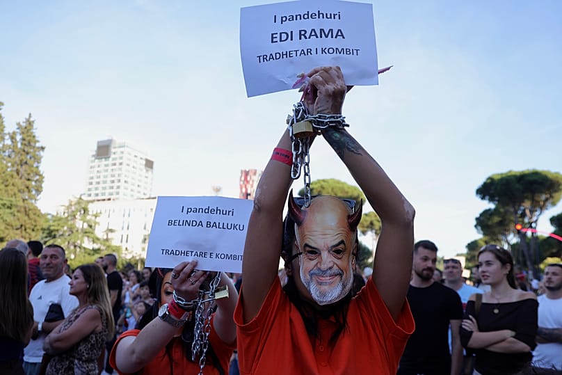 The banner reads : " Defendant Edi Rama is nation's traitor ". (AP Photo/Hameraldi Agolli)