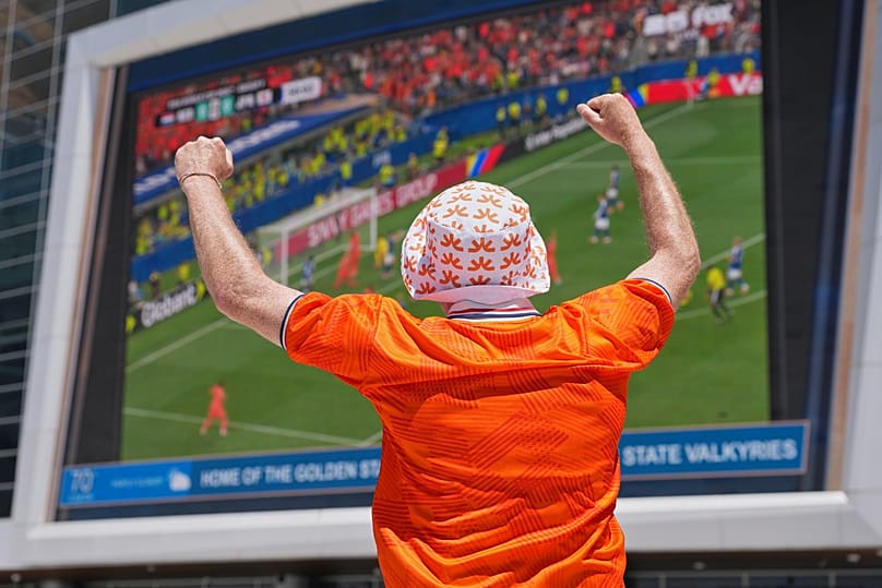 A Dutch fan celebrates his team's goal against Japan as he watches a public viewing of the World Cup match against Japan in San Francisco, Sunday June 14, 2026