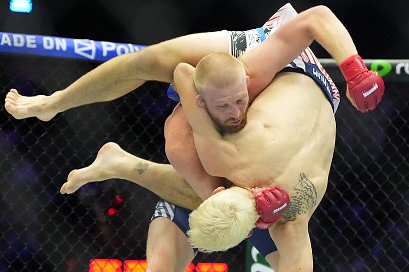 Bo Nickal, top, fights against Kyle Daukaus during their middleweight bout at UFC Freedom 250 on the South Lawn of the White House, Sunday, June 14, 2026, in Washington