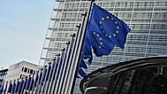 European Union flags flap in the wind outside of EU headquarters in Brussels, 4 November, 2025