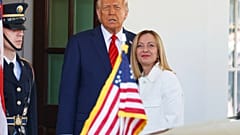 President Donald Trump, center, greets Italy's Prime Minister Giorgia Meloni, right, upon her arrival at the White House, April 17, 2025, in Washington. (AP Photo/Tom Brenner)