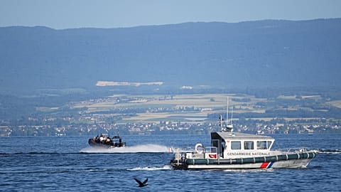 A France's National Gendarmerie boat patrols on Lake Geneva ahead of the G7 summit in Evian-les-Bains, France, Monday, June 15, 2026. (AP Photo/Christophe Ena)