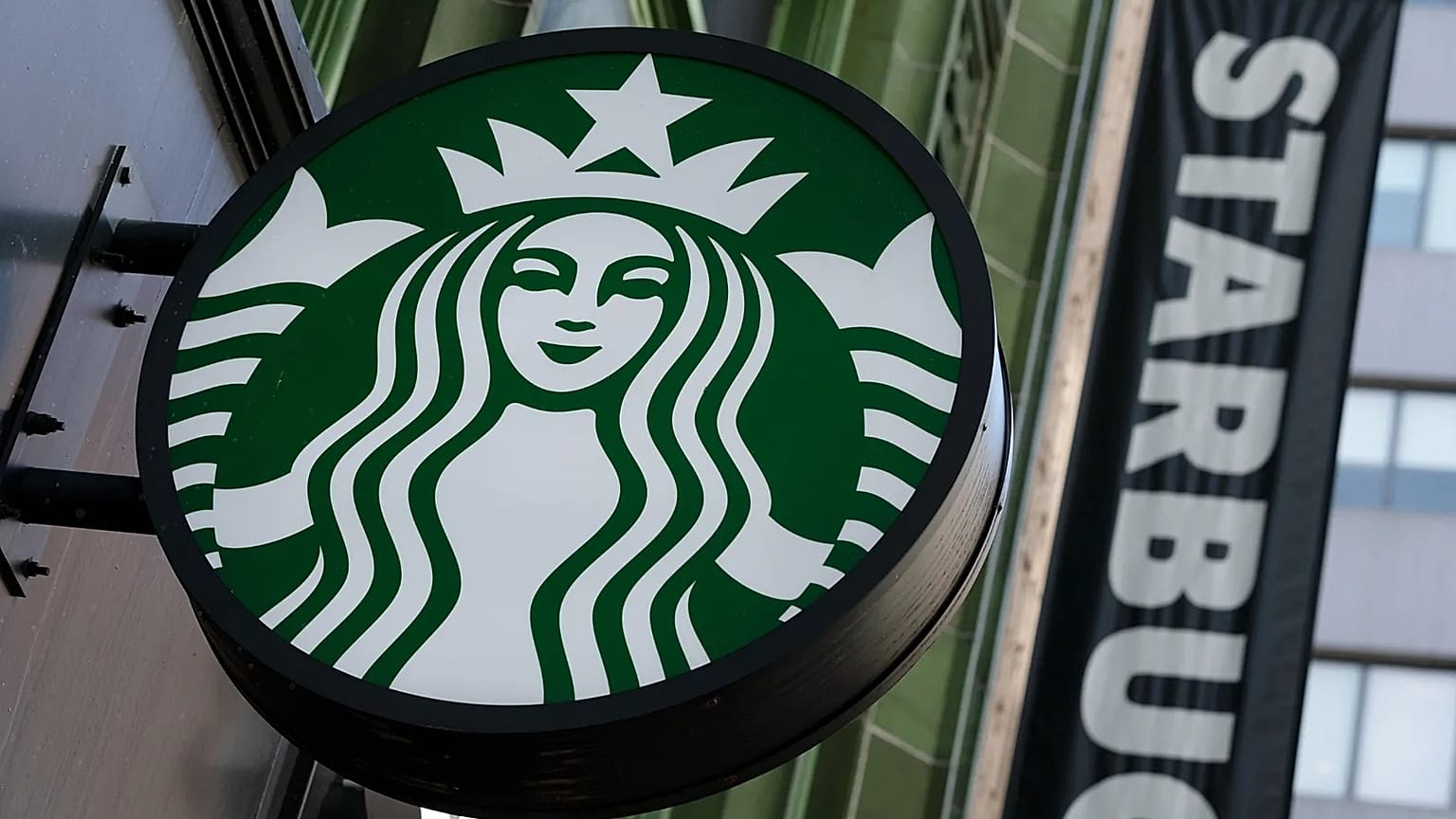 The Starbucks logo is seen on a storefront, 14 October, 2022