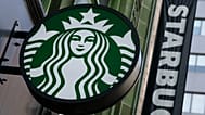 The Starbucks logo is seen on a storefront, 14 October, 2022