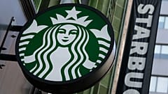 The Starbucks logo is seen on a storefront, 14 October, 2022