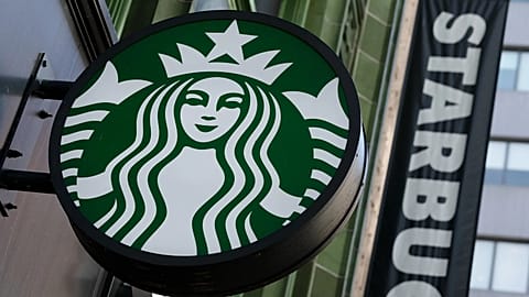 The Starbucks logo is seen on a storefront, 14 October, 2022