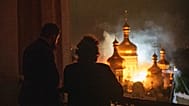 Bishop Avraamiy of the Kyiv-Pechersk Lavra looks at the burning Dormition Cathedral also known as the Monastery of the Caves, during a Russian strike on Kyiv, Ukraine, June 15