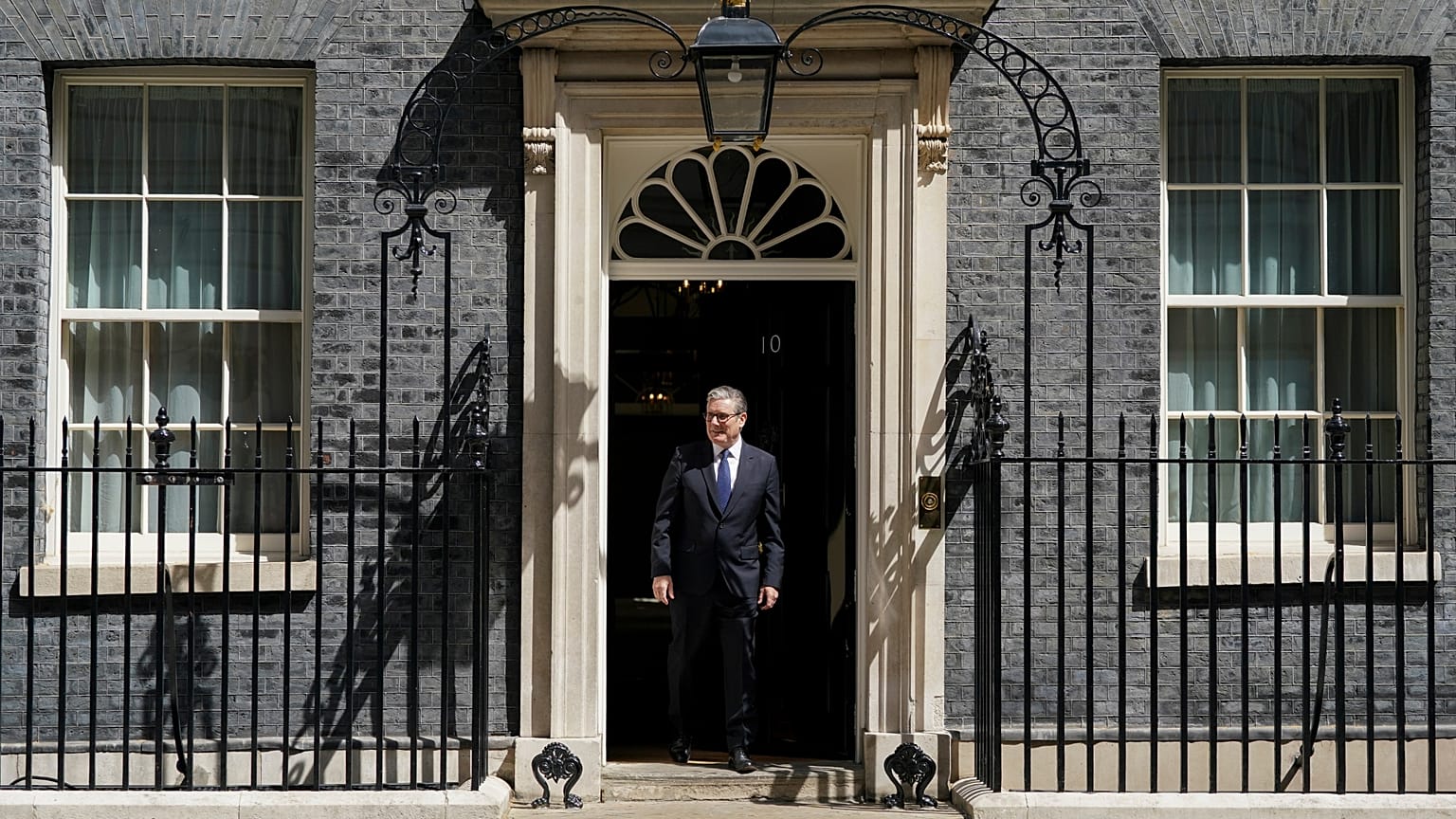 Britain's Prime Minister Keir Starmer steps out of 10 Downing Street.