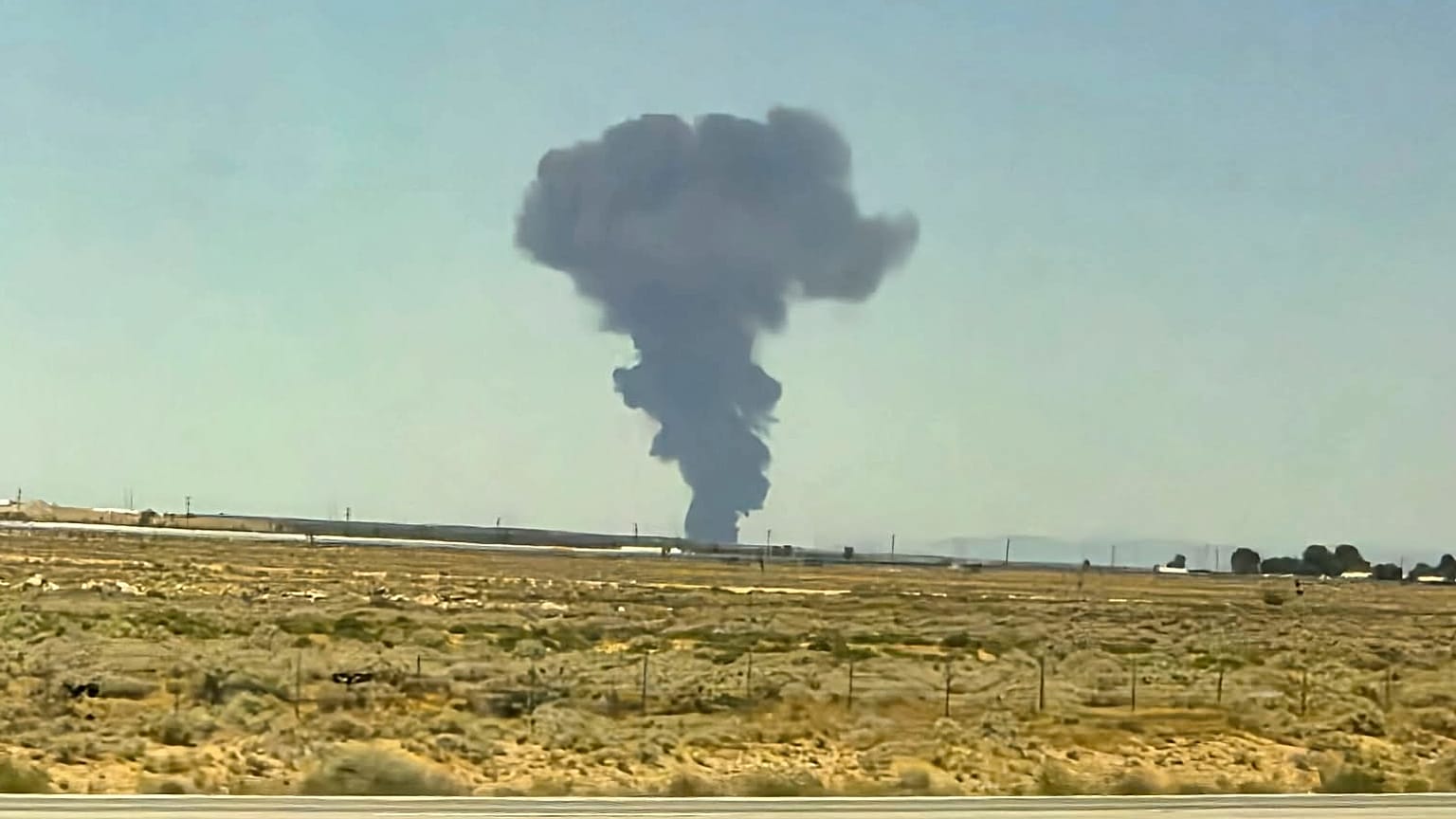 Smoke plumes rise from a B-52 bomber that crashed shortly after takeoff at a U.S. Air Force base in Southern California, Monday, June 15, 2026.