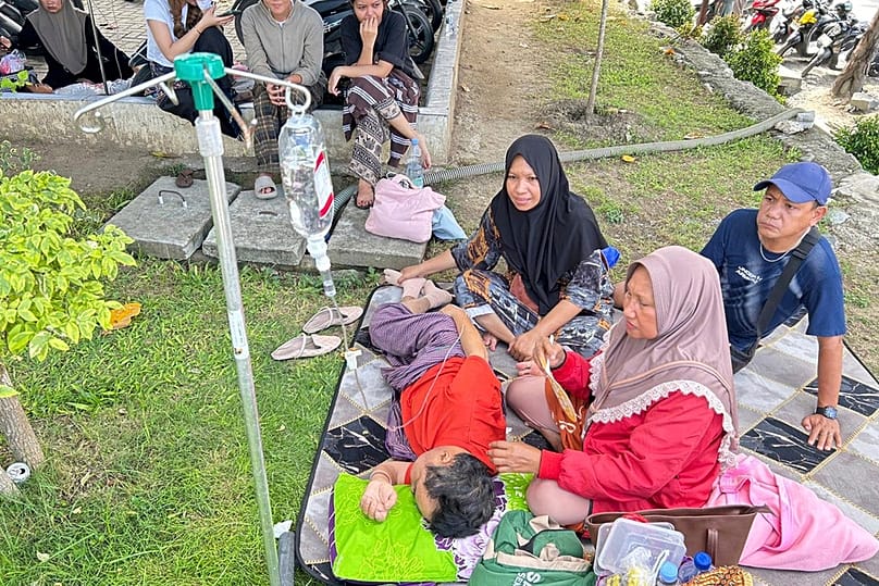 Patients who were evacuated are seen outside of a local hospital following an earthquake in Palu, Central Sulawesi, Tuesday, June 16, 2026