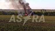 Wreckage of a Russian Tu-22M3 strategic bomber lies in a field in the Irkutsk region after it crashed during a training flight.