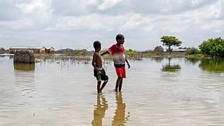 FILE: Children walk in a flooded field in Mandera County, Kenya.
