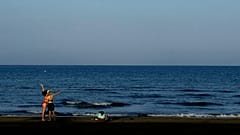 FILE: Two tourists take a selfie photo on the beach in southern coastal city of Larnaca in the south east Mediterranean island of Cyprus.