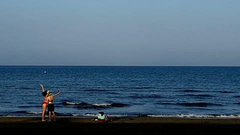 FILE: Two tourists take a selfie photo on the beach in southern coastal city of Larnaca in the south east Mediterranean island of Cyprus.