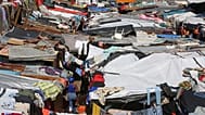 Makeshift tents fill a camp set up by people displaced from their homes by gang violence in Port-au-Prince, 14 April, 2025