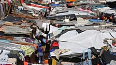 Makeshift tents fill a camp set up by people displaced from their homes by gang violence in Port-au-Prince, 14 April, 2025