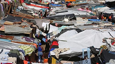 Makeshift tents fill a camp set up by people displaced from their homes by gang violence in Port-au-Prince, 14 April, 2025