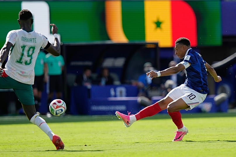 France's Kylian Mbappe shoots and scores their third goal during the World Cup Group I match against Senegal in East Rutherford, NJ, near New York, Tuesday, June 16, 2026.