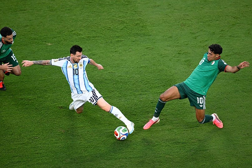 Argentina's Lionel Messi battles for the ball with Algeria's Fares Chaibi during the World Cup Group J match against Algeria in Kansas City, Mo, Tuesday, June 16, 2026