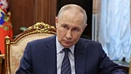 Russian President Vladimir Putin listens to Transport Minister Andrey Nikitin during their meeting at the Kremlin in Moscow, Monday, June 15, 2026.