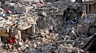 A man flashes peace sign as he stands on the rubble of his destroyed house in Nabatiyeh town, southern Lebanon, Tuesday, June 16, 2026.