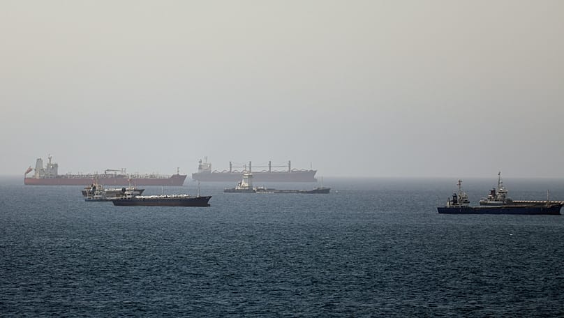 Tankers and cargo vessels are seen in the Gulf of Oman, along shipping routes linking the Strait of Hormuz and the Arabian Sea, Tuesday, June 16, 2026.