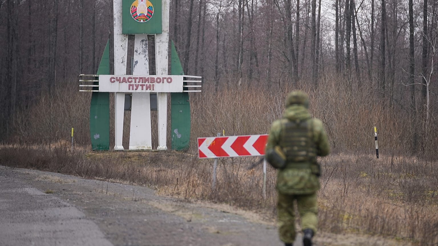 FILE: A Belarusian border guard inspects a road from Belarusian border checkpoint, in Gomel region, Belarus, Tuesday, Jan. 28, 2025.
