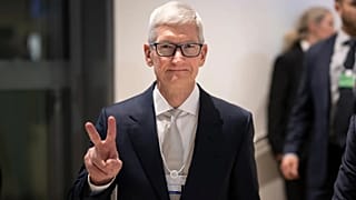 File - Tim Cook, Apple CEO, makes a victory sign to the photographer in the corridors during the 56th annual meeting of the WEF, in Davos, Switzerland. 20 Jan 2026