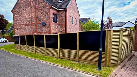 A house with solar fencing panes.