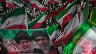 FILE: Pro-regime demonstrators wave Iranian flags and a portrait of Ayatollah Mojtaba Khamenei and his slain father in a gathering at a square in Tehran, 29 May 2026