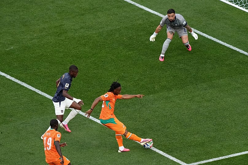Ivory Coast's Elye Wahi, center, shoots against Ecuador goalkeeper Hernan Galindez during the World Cup match between Ivory Coast and Ecuador in Philadelphia, June 14, 2026