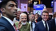 India's Prime Minister Narendra Modi, center left, and France's President Emmanuel Macron, front right, visit the Vivatech fair in Paris